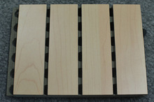 Wood-layer acoustic panel with groove